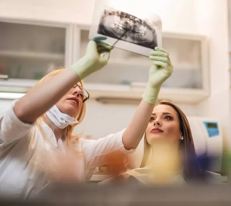 Dentists reviewing dental X-ray